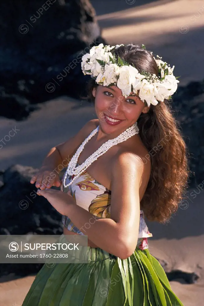 Hula dancer on beach, body turned to the side