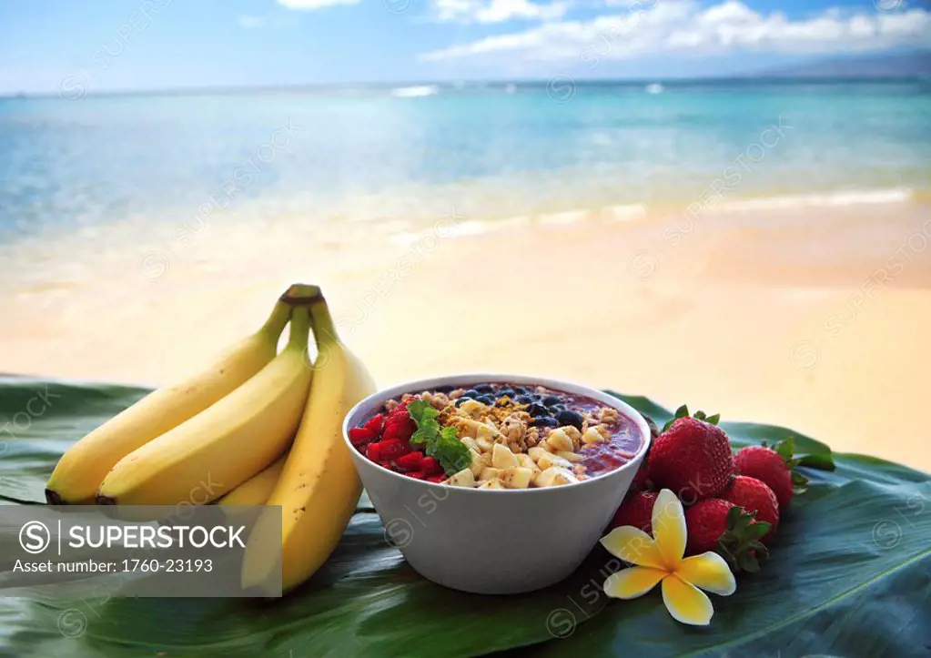 Hawaii, Oahu, Healthy and Organic Berry Acai Bowl product with blue ocean in background