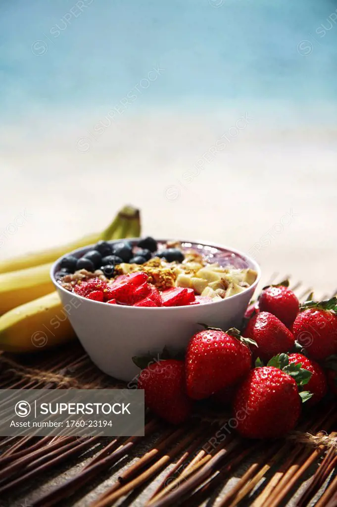 Hawaii, Oahu, Healthy and Organic Berry Acai Bowl product with blue ocean in background