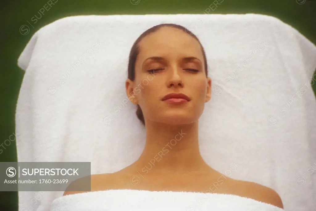Beauty shot of girl resting on spa/massage table