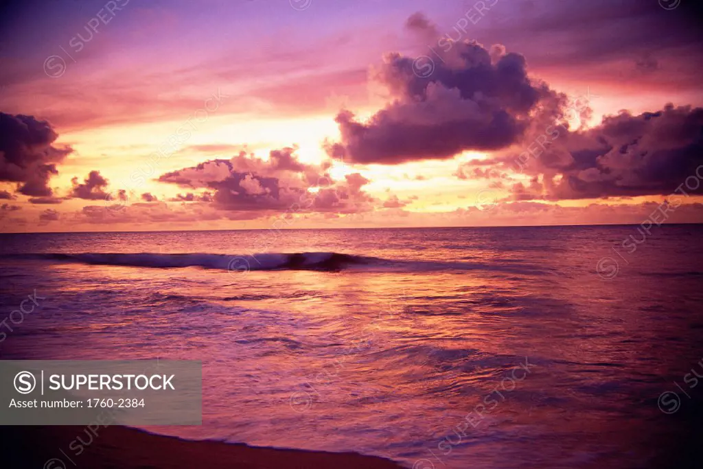 Hawaii, Sunset over ocean with tiny wave, tropical scenic reflections A32E