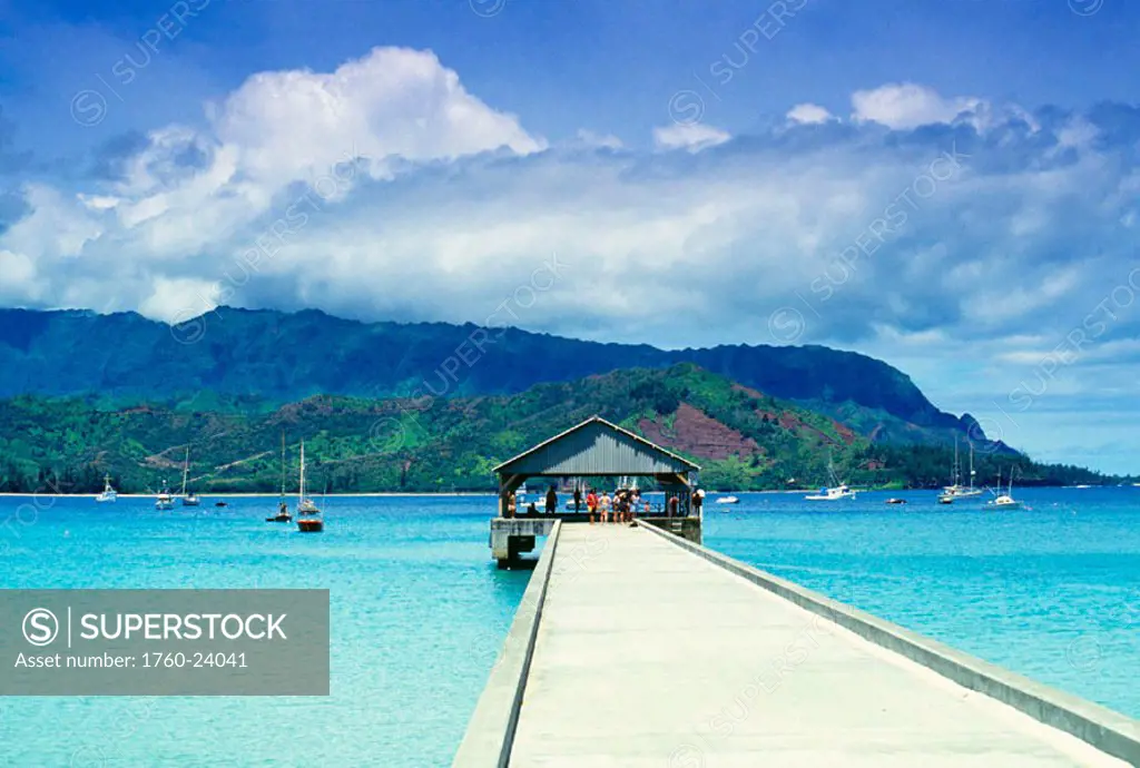 Hawaii, Kauai, Hanalei Bay and pier, warm sunny day, people on dock, boats in bay