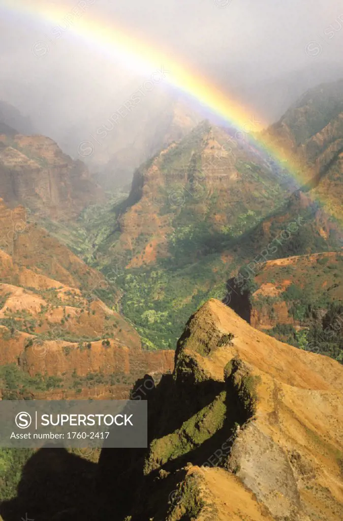 Hawaii, Kauai, Bright rainbow over Waimea Canyon.