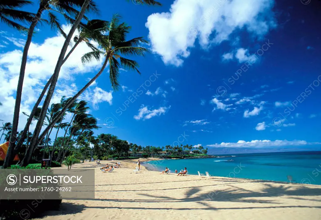 Hawaii, Maui, Napili, people relaxing on white beach by turquoise ocean