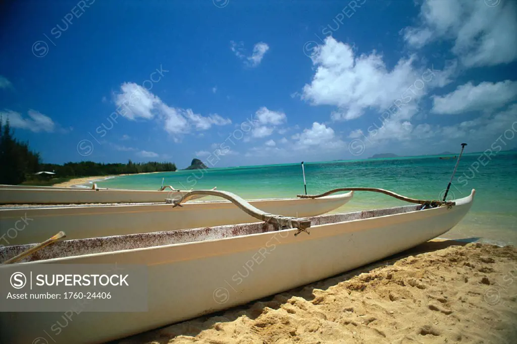 HI, Oahu, Kaneohe Bay,  closeup of outrigger canoe on beach, turquoise water