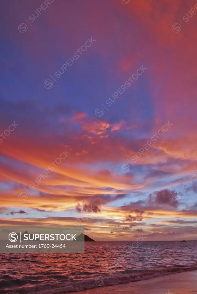 Hawaii, Oahu, Lanikai, A colorful pink sunrise over the Mokolua islands.