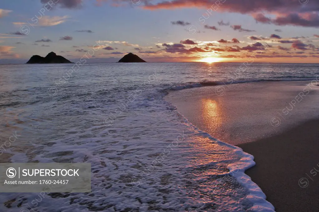 Hawaii, Oahu, Lanikai, sunrise with the Mokolua islands in the distance.