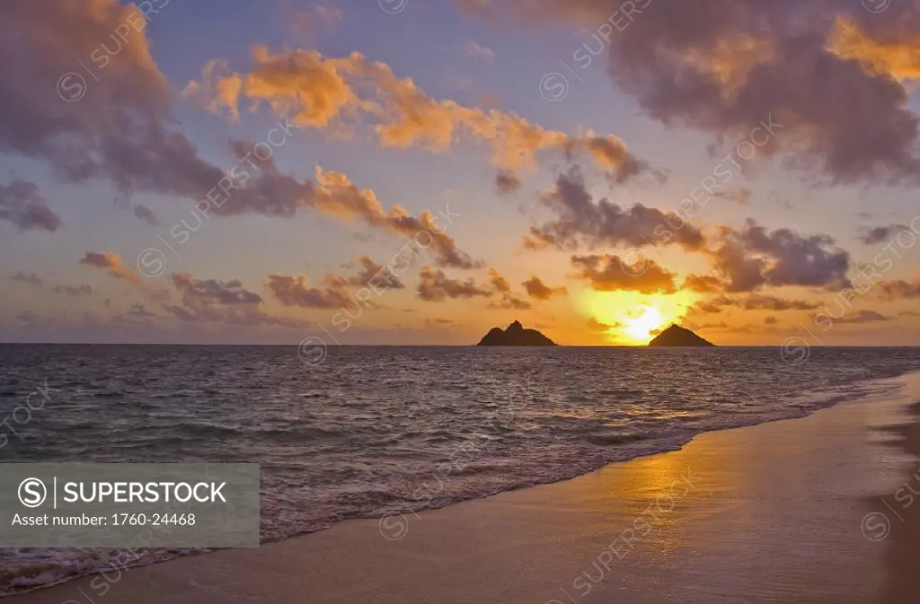 Hawaii, Oahu, Lanikai, sunrise with the Mokolua islands in the distance.