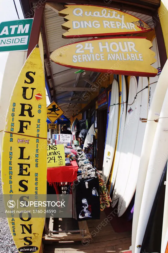Hawaii, Oahu, North Shore, Haleiwa, Outside of local surf shop, signs and merchandise.