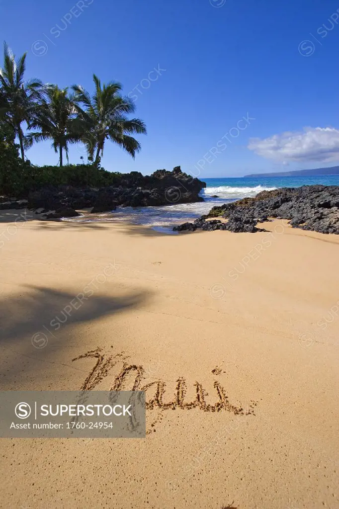 Hawaii, Maui, Makena, Secret Beach, the word Maui written in the sand.