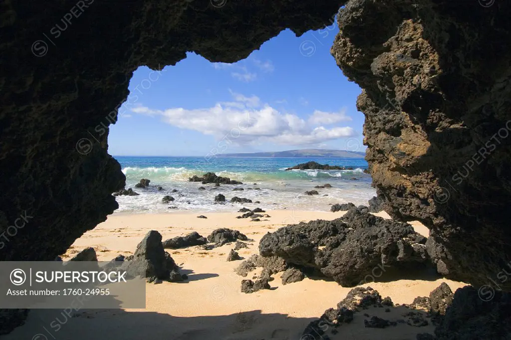 Hawaii, Maui, Makena, View from Secret beach of Kahoolawe framed by lava tube.