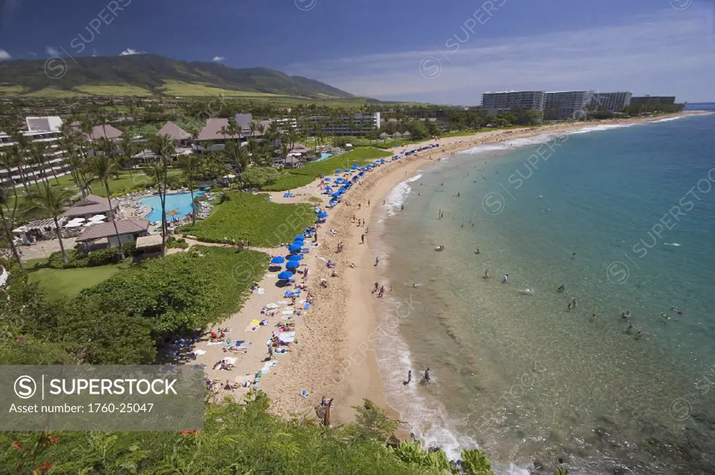 Hawaii, Maui, Kaanapali Beach, West Maui mountains, Resort hotels and people on the beach.