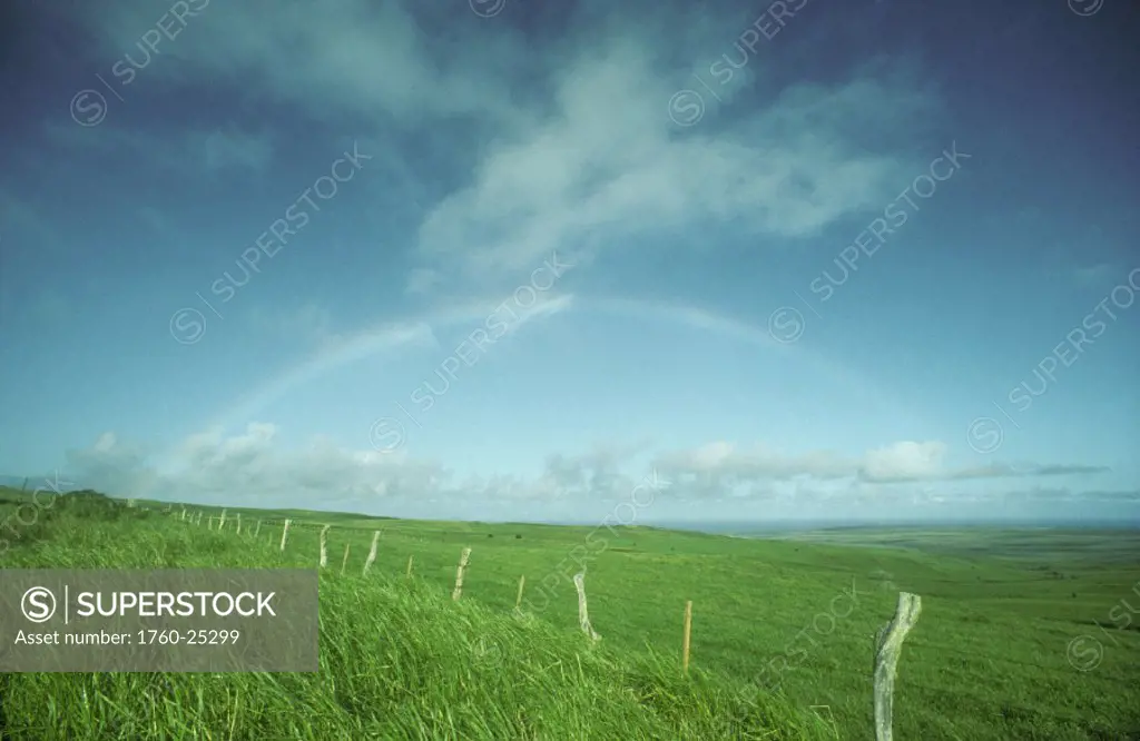 Hawaii, Molokai, Molokai Ranch, Rainbow over ranchland near Maunaloa.