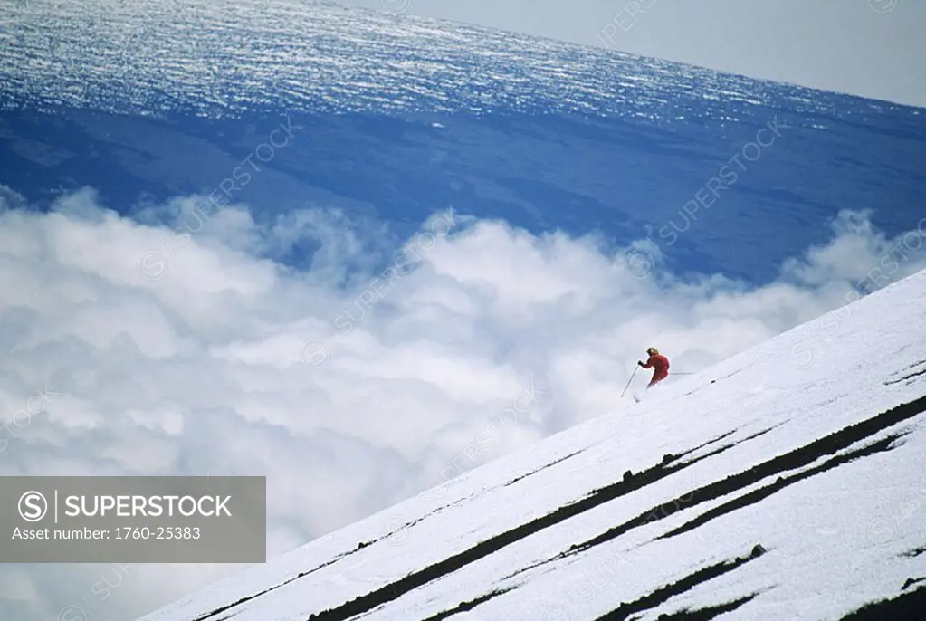 Hawaii, Big Island, Mauna Kea, Woman skiing downhill at high elevation