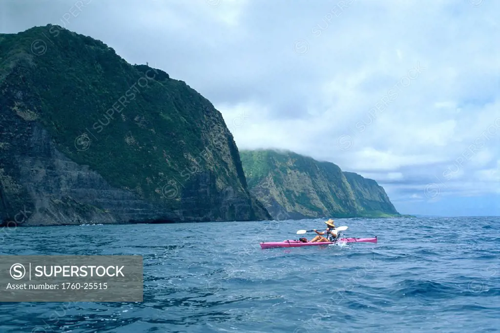 Hawaii, BigIsle, North Shore along coastline, person kayaking