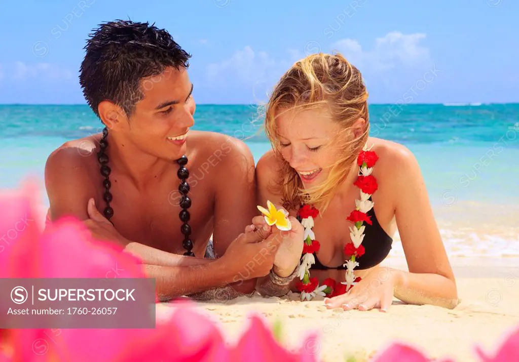 Hawaii, Oahu, Lanikai, Young couple on the beach.