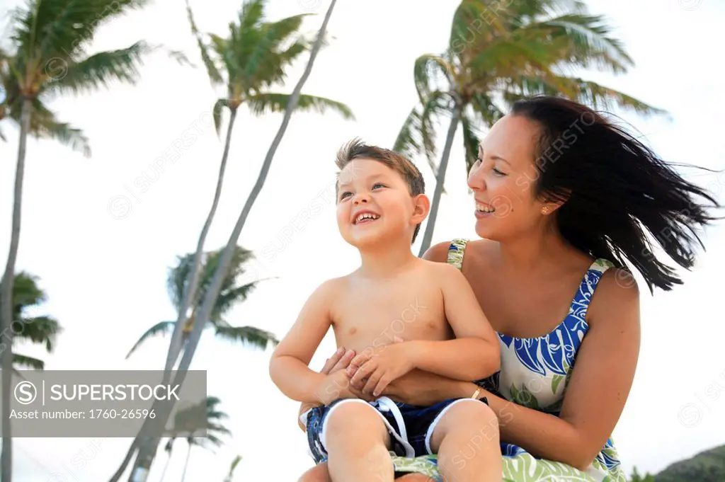 Hawaii, Oahu, A happy mother interacting with her son.