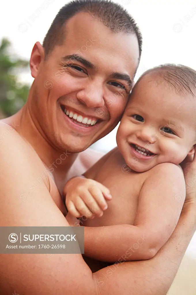 Hawaii, Oahu, A happy father interacting with his son.