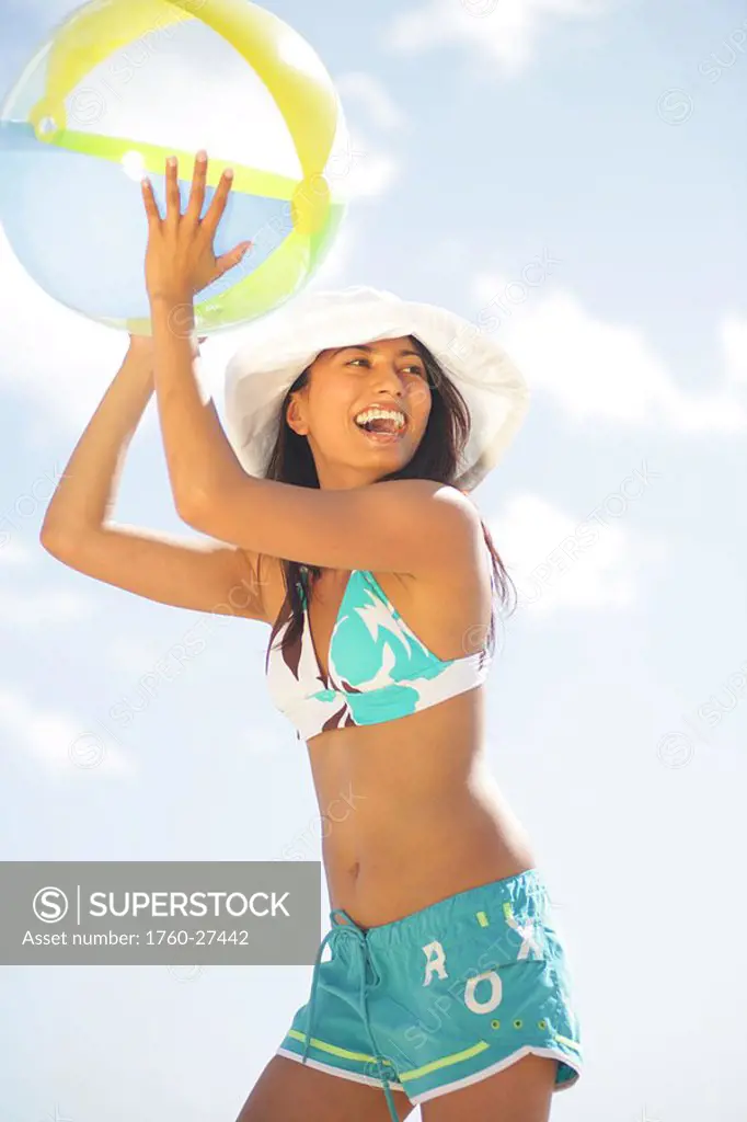 Girl on the beach with a beachball