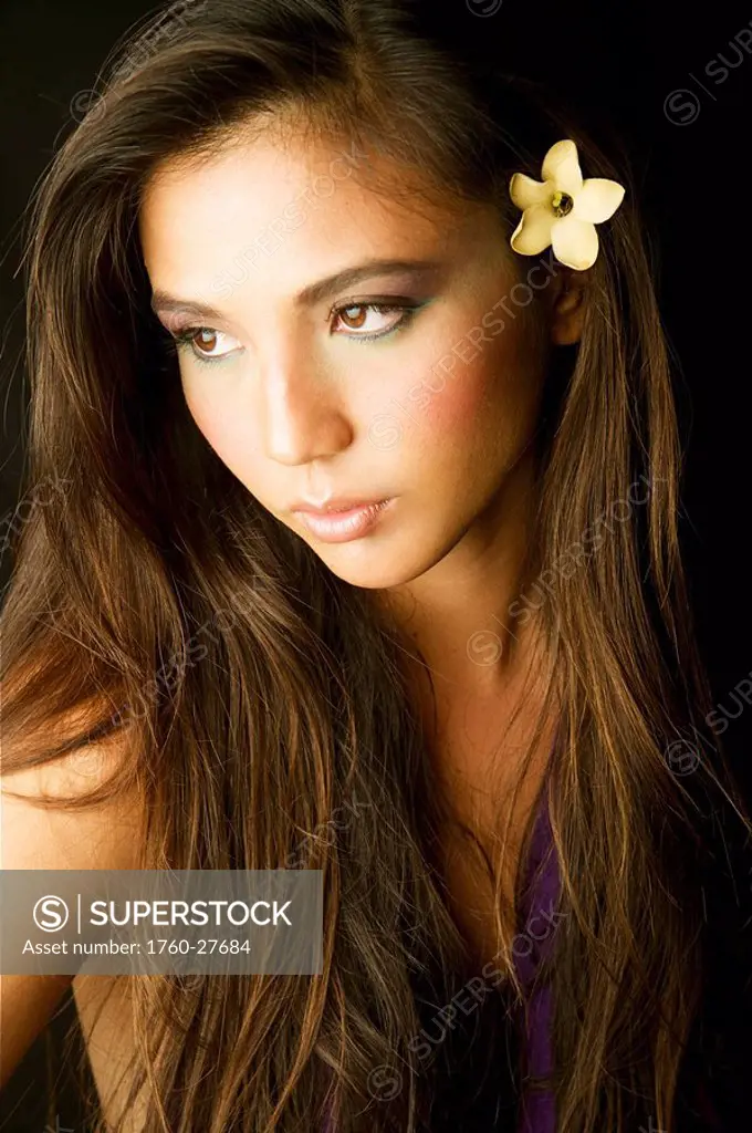 Hawaii, Studio headshot of a beautiful girl with a bird_of_paradise.