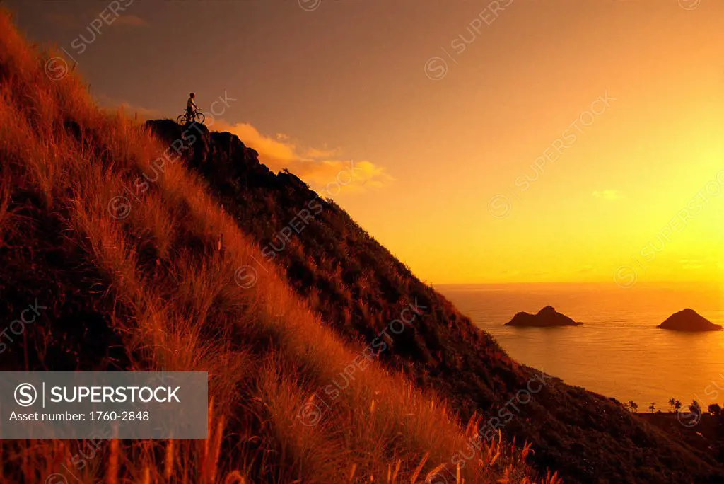 Mountain biking, view of Mokulua Isles, Lanikai Windward Oahu, Hawaii B1241