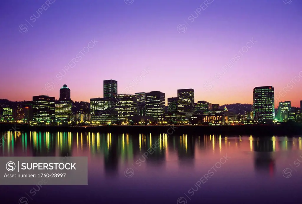 Oregon, Portland, View across Willamette River of Portland skyline at twilight.