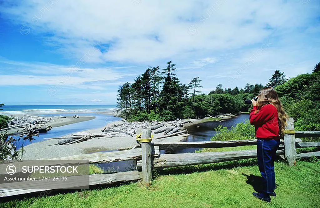 Washington, Olympic National Park, Kalaloch Lodge, Woman taking picture of coastal scenic