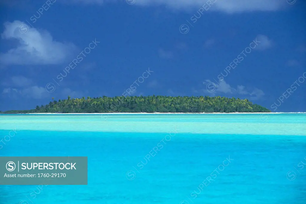 Cook Islands, Aitutaki, tropical island w/ calm turquoise water, blue skies