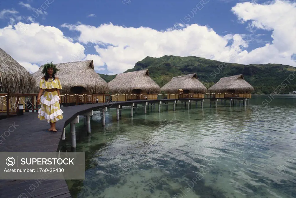 French Polynesia, Huahine, Sofitel Heiva Hotel bungalows, Polynesian woman.