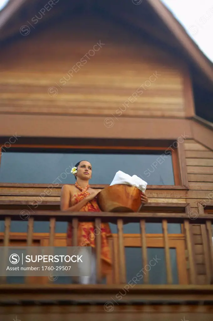 French Polynesia, Tahiti, Bora Bora, Bora Bora Lagoon Resort, Banyan Spa, Polynesian woman holding bowl of towels. NO MODEL RELEASE