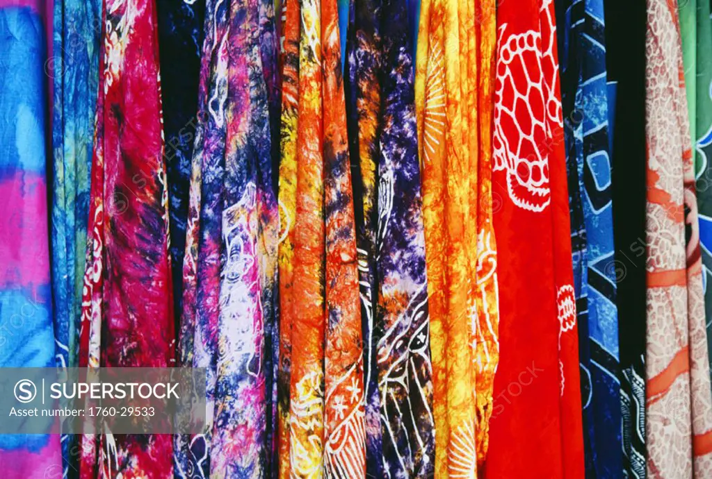 French Polynesia, Tahiti, Papeete, closeup of many colorful pareos for sale at market