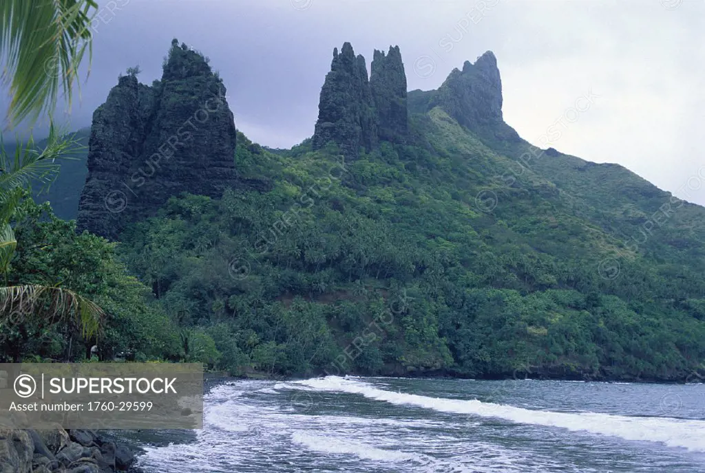 FP Marquesas Islands Nuku Hiva, Hatiheu Bay, dramatic mountains background, coast