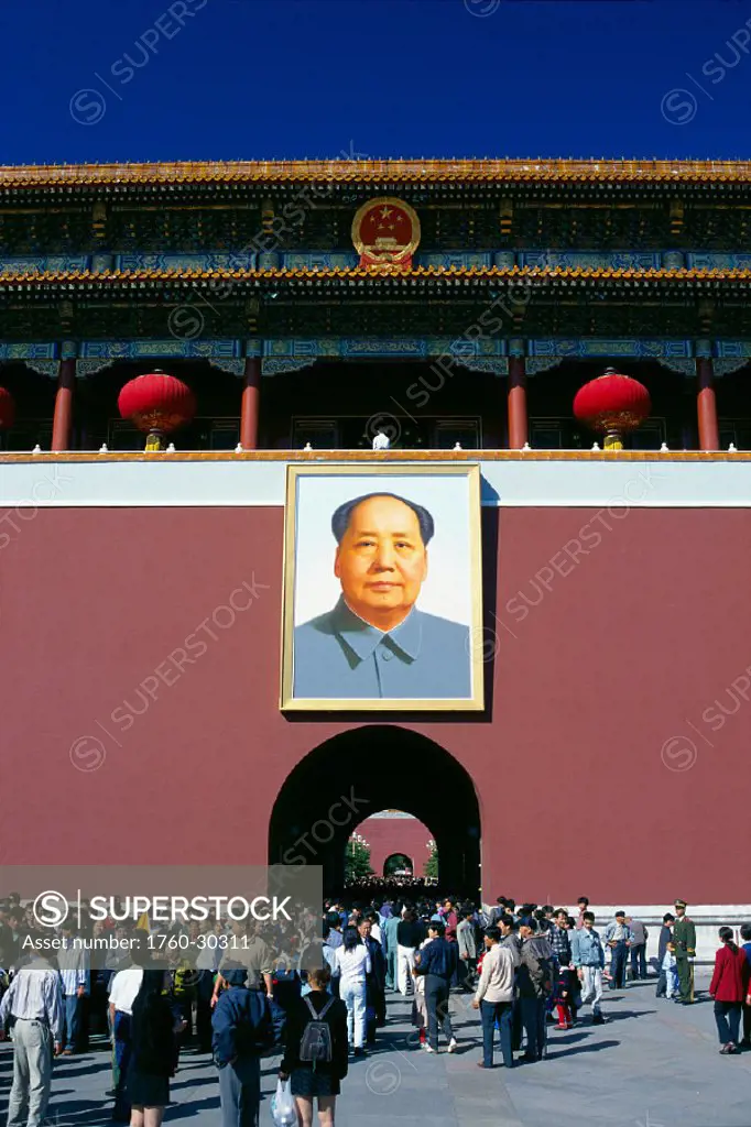 China, Beijing, view of people in plaza, large image of Mao in background