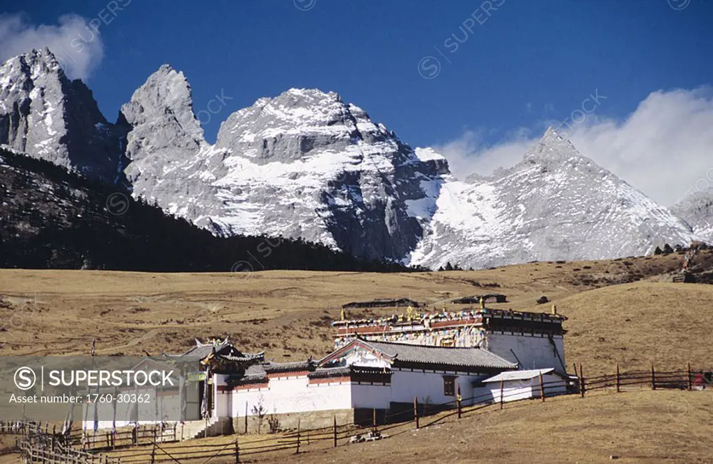 China, Lijang, old Buddhist temple on Yak Meadow, Jade Dragon Snow Mountain in background