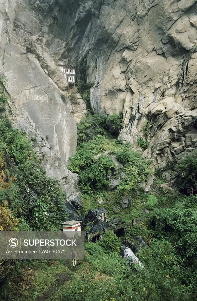 Bhutan, Paro Valley, Tiger´s Nest, Buildings on rocky cliffs, Hiker on trail