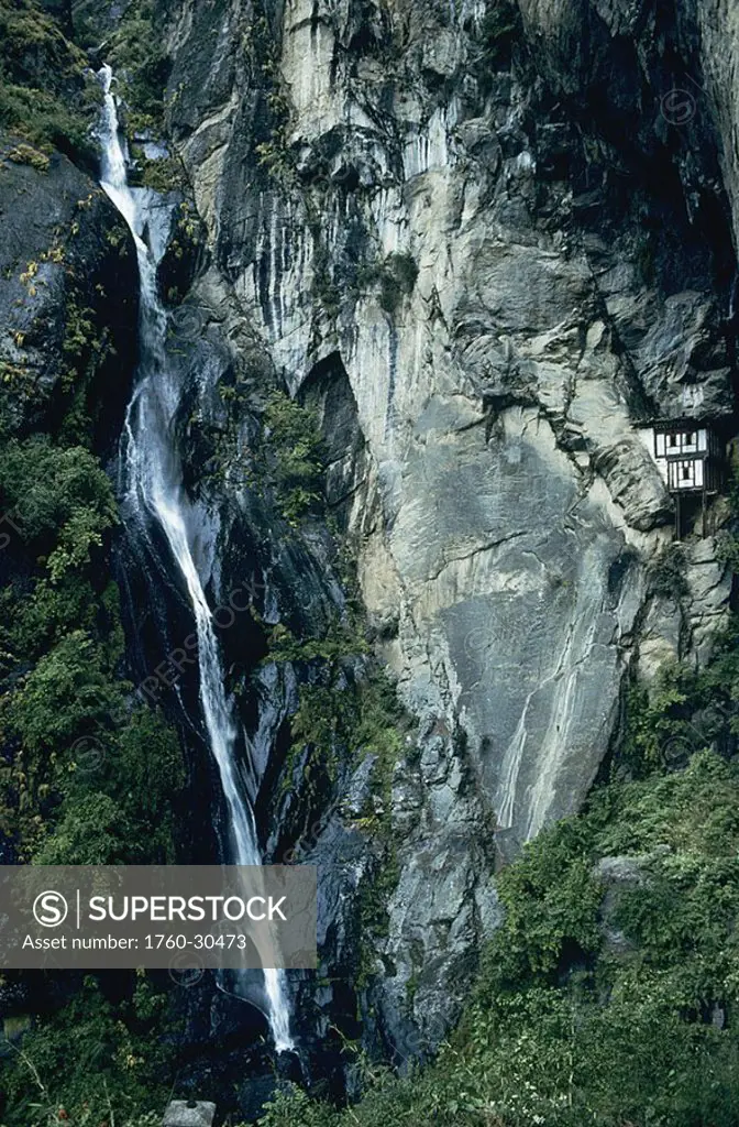 Bhutan, Paro Valley, Tiger´s Nest, Waterfall cascading down rocky cliff