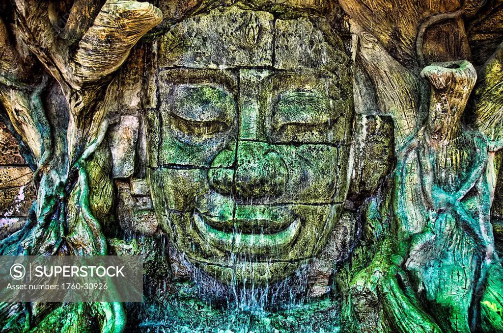 Thailand, Nakhon Ratchasima, Ancient and discolored stone Buddha face found at Wat Sala Loi.