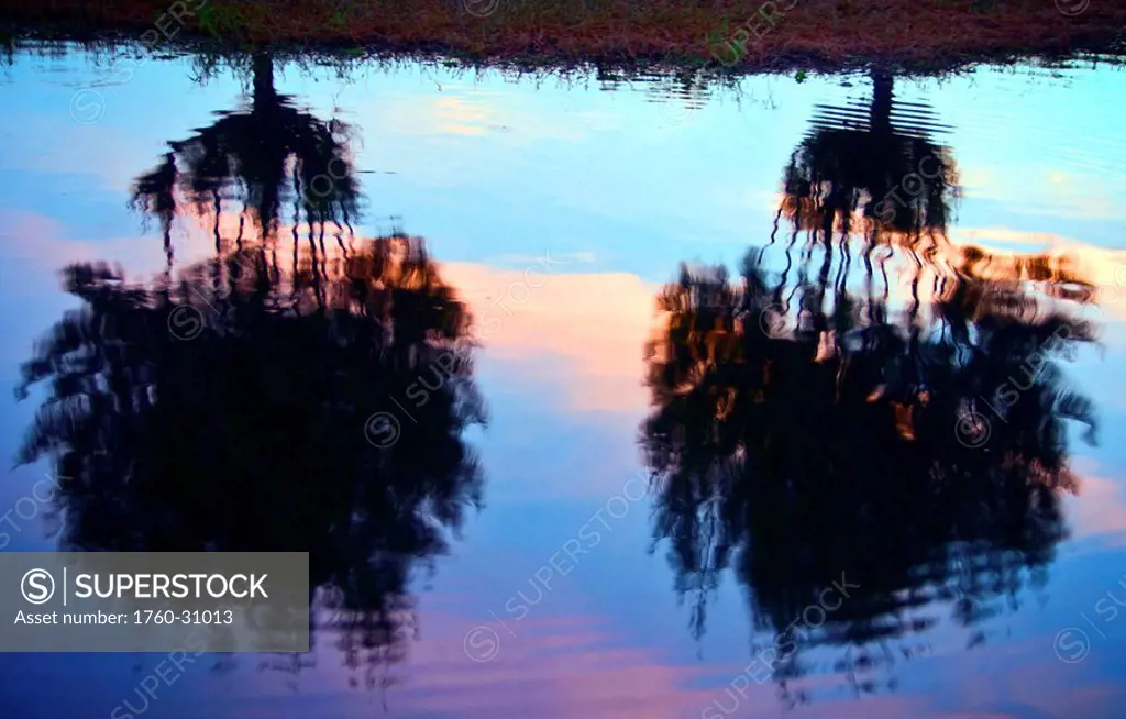 Thailand, Khon Kaen, Dusk falls on Bung Kaen Nakhon Lake and creates a beautiful relfection.