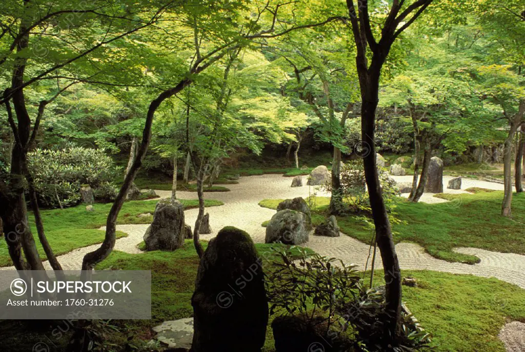 Japan, Kyushu, Dazaifu, Komyo-ji Temple garden lush, green sand path with large rocks