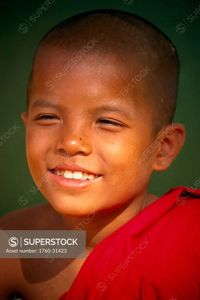 Myanmar (Burma), Bago, closeup portrait of young monk boy