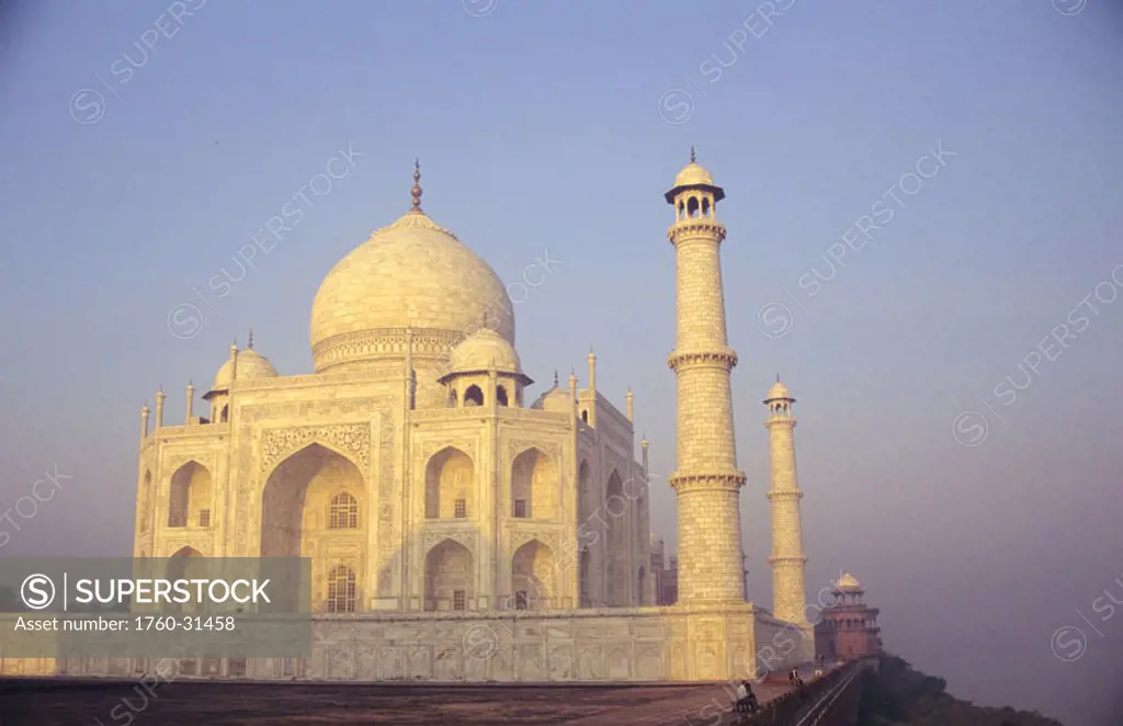 India, Agra, Taj Mahal, late afternoon with shadows and blue sky, angled view from front.