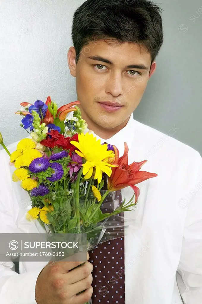 Businessman holding a bouquet of flowers
