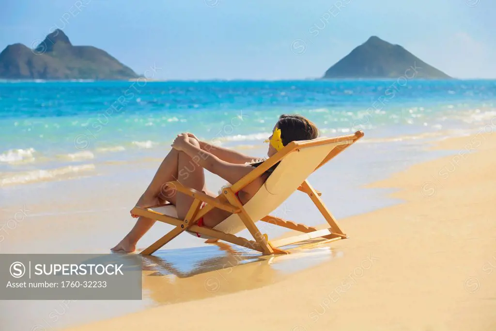 Hawaii, Oahu, Kailua, Lanikai, Beautiful Woman Lounges On A Remote Beach.