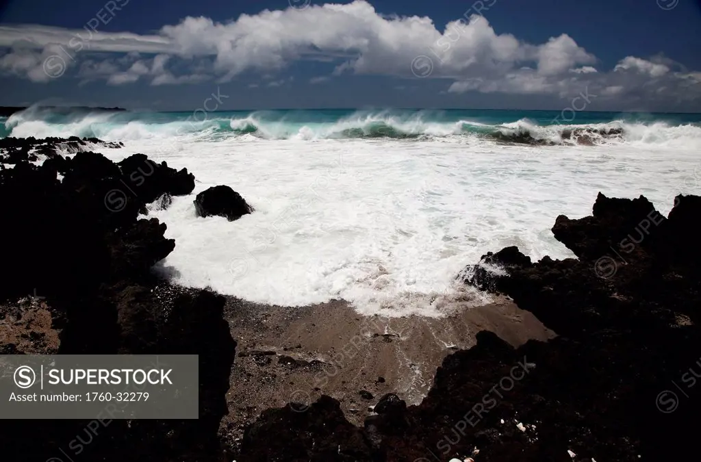 Hawaii, Maui, La Perouse, A Wave Breaks With Lave Rocks In The Foreground.