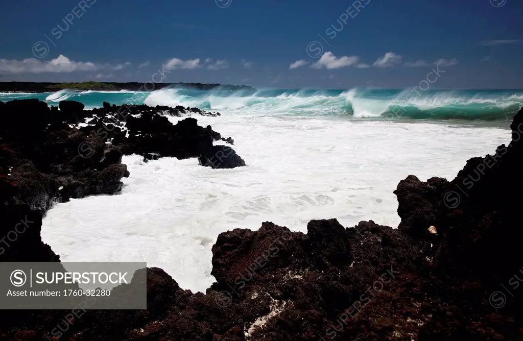 Hawaii, Maui, La Perouse, A Wave Breaks With Lave Rocks In The Foreground.