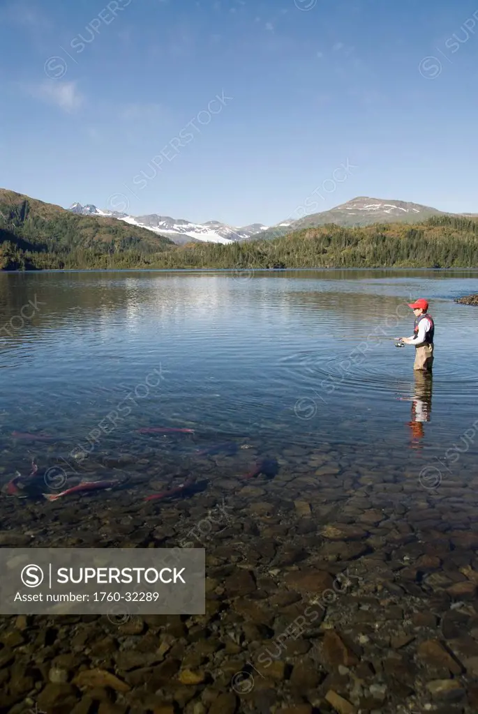 Alaska, Prince William Sound, A Boy Fishing For Salmon At Shrode Lake.