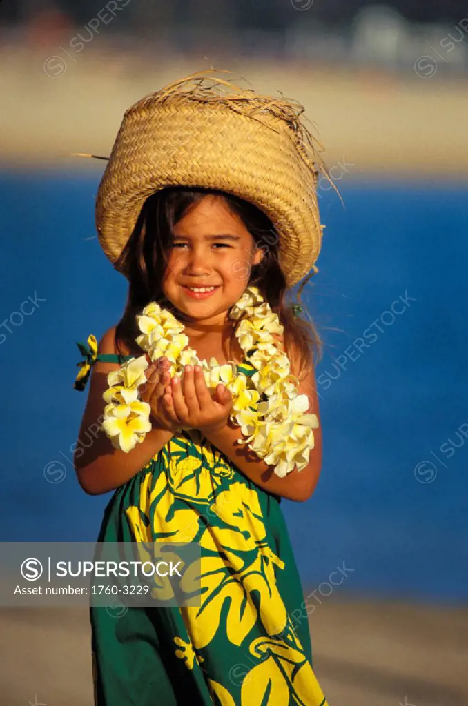 Hawaii, Keiki hula at beach, dressed in muu muu, flower lei and straw hat