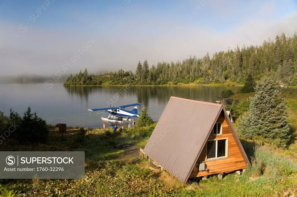Usa, Alaska, Prince William Sound, Shrode Lake, Float Plane Parked By Us Forest Service Cabin.