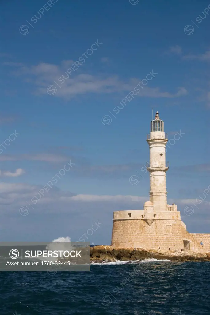 Greece, Crete, Hania, Wave Crashing On A Lighthouse.