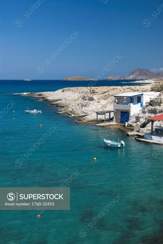 Greece, Cyclades, Island Of Milos, Village Of Mitakas, Boats And Houses Near Shore.